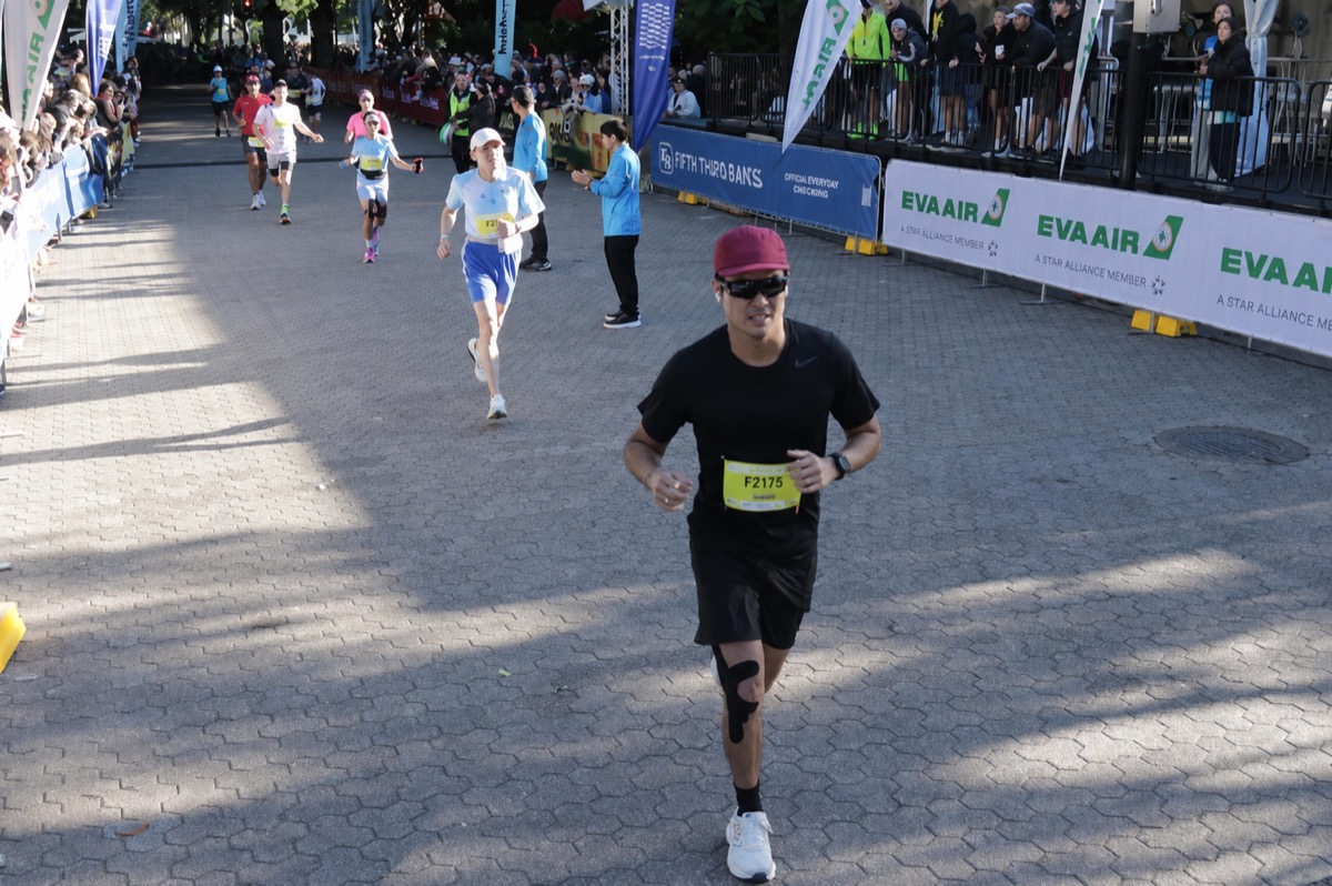 Runner on a paved race course